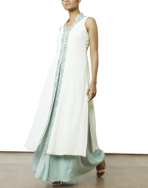 Cream paneled tunic with blue resham and white beads embroidered on to the collar, neckline and center front of the tunic, paired with a powder blue gathered skirt.