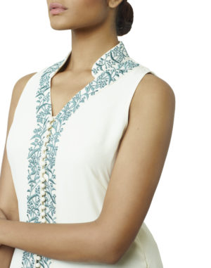 Cream paneled tunic with blue resham and white beads embroidered on to the collar, neckline and center front of the tunic, paired with a powder blue gathered skirt.